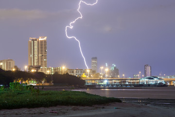 Lightning bolt strike into sea with natural lens flare