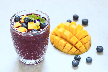 Fresh smoothie with mango and blueberry