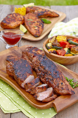 Grilled pork tenderloin served with greenery