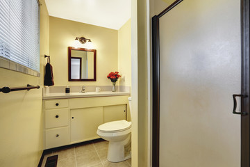 Beige bathroom interior with tile floor