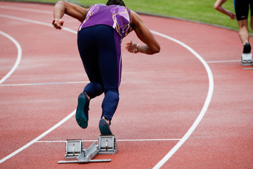 Sprinter leaving starting blocks