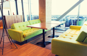 restaurant interior with table and sofas