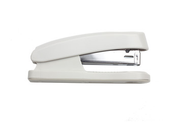 White and metal stapler over a white background - obrazy, fototapety, plakaty