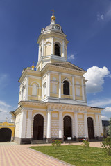 Fototapeta na wymiar The bell tower with the gate Church of the Three Hierarchs of the Vysotsky monastery, Serpukhov, Moscow region, Russia