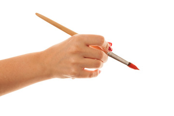 woman paints a picture with a red brush
