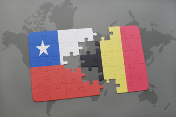 puzzle with the national flag of chile and belgium on a world map background.