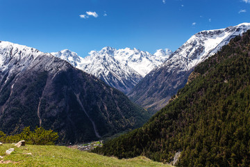 Fototapeta na wymiar Panoramic view of the main Caucasus ridge in summer