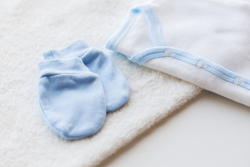 close up of baby boys clothes for newborn on table