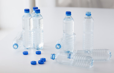 close up of bottles with drinking water on table