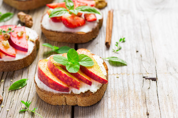 bruschetta with peaches, plums, strawberries and cottage cheese.