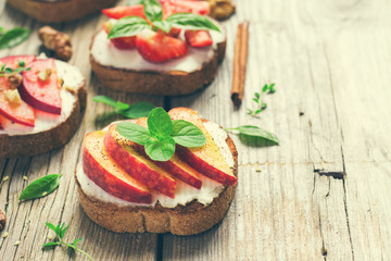 Summer breakfast bruschetta with peaches, plums, strawberries an