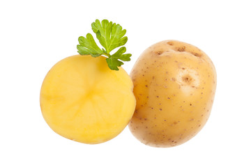 Two yellow potatoes and green parsle. Isolated on white backgrou