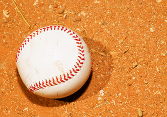 Fototapeta na wymiar Baseball on a red field