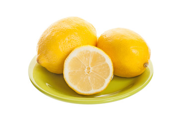 Fresh lemon in a plate isolated on a white background