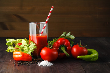 Fresh tomatoes juice with herb on rustic wooden table
