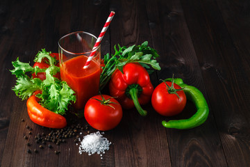 Fresh tomatoes juice with herb on rustic wooden table