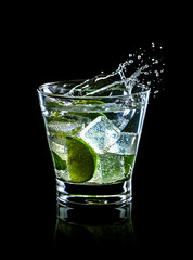 Mojito cocktail on black background with splash