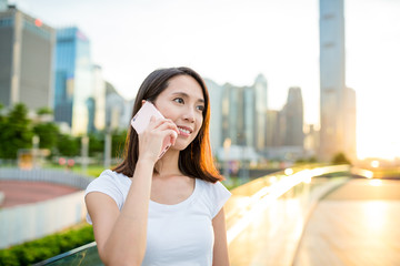 Fototapeta premium Woman talking to mobile phone