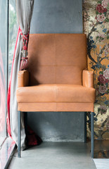 chair near a large window
