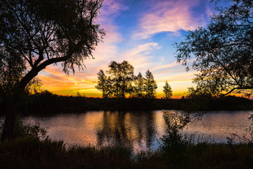 landscape of sunset with cloudy orange sky