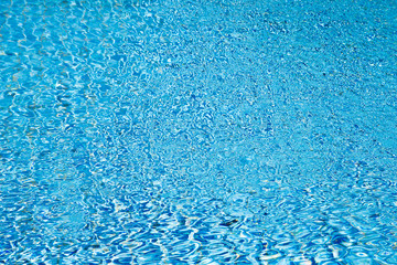 Blue water with sun reflections