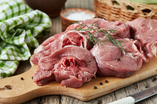 Fresh raw mutton on cutting board. horizontal