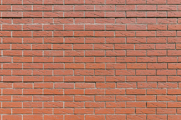 Wall from an equal red brick, background, texture series