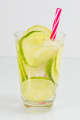 Cold green lime juice with ice cubes