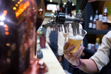 Bartender pouring beer