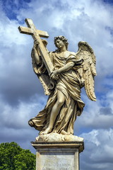 Naklejka premium Angel with the Cross statue on the Ponte Sant' Angelo bridge, Rome, Italy