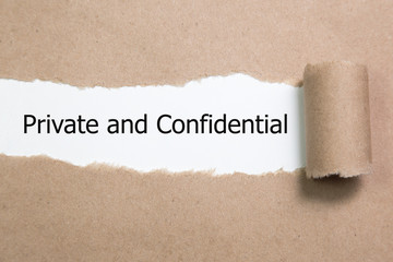 The word Private and confidential appearing behind torn paper.