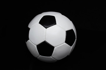 Fototapeta premium soccer ball on a black background