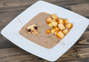 Creamy Mushroom Soup on wooden table