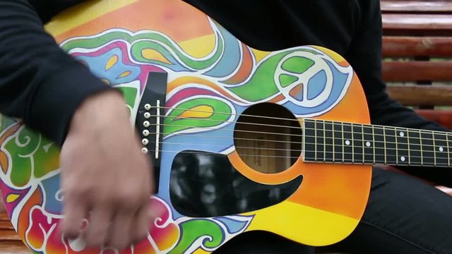 cool gypsy style man plays guitar