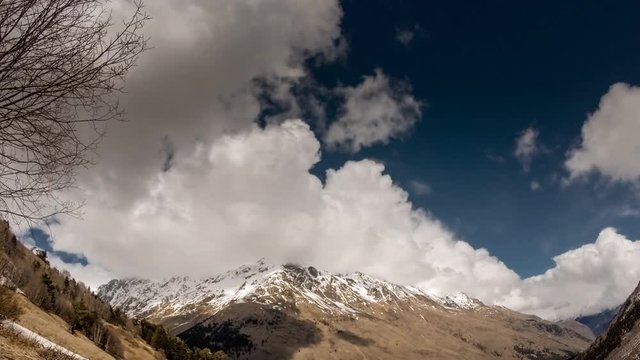 Time lapse of Flowing clouds around Ushba peak in autumn morning in the Caucasus mountains