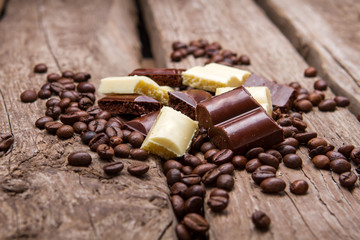Chocolate and coffee beans. White and brown chocolate. Snack for boosting energy. Product from high quality cocoa.