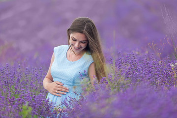 Lavender field and a happy pregnant woman