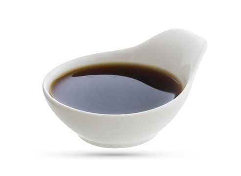 Dish of soy sauce isolated on white