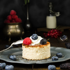 Ukrainian cheesecake with berries and cream, still life