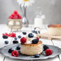 Ukrainian cheesecake with berries and cream, still life