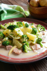 Pork with broccoli, ginger root and boiled potatoes