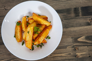 potato in a bowl on wooden background