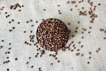 Burlap texture with coffee beans heart shape