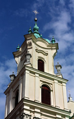 Fototapeta na wymiar Baroque tower of the old time catholic church