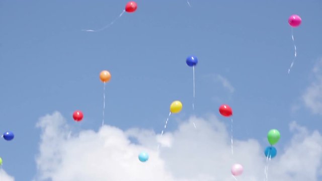 a lot of balloons in the sky
