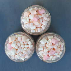 Three glass jars filled to brim marshmallow