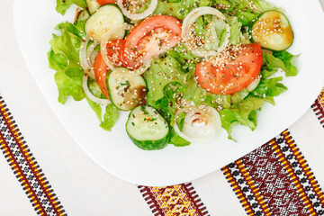 Salad of fresh greens  with soy sauce, dry spices and sesame