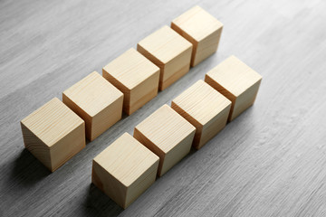 Wooden cubes on light grey background