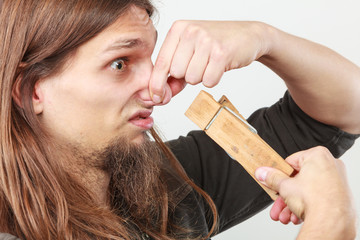 Man with clogged nose by clothespin