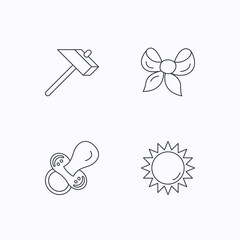 Hammer, pacifier and sun icons.